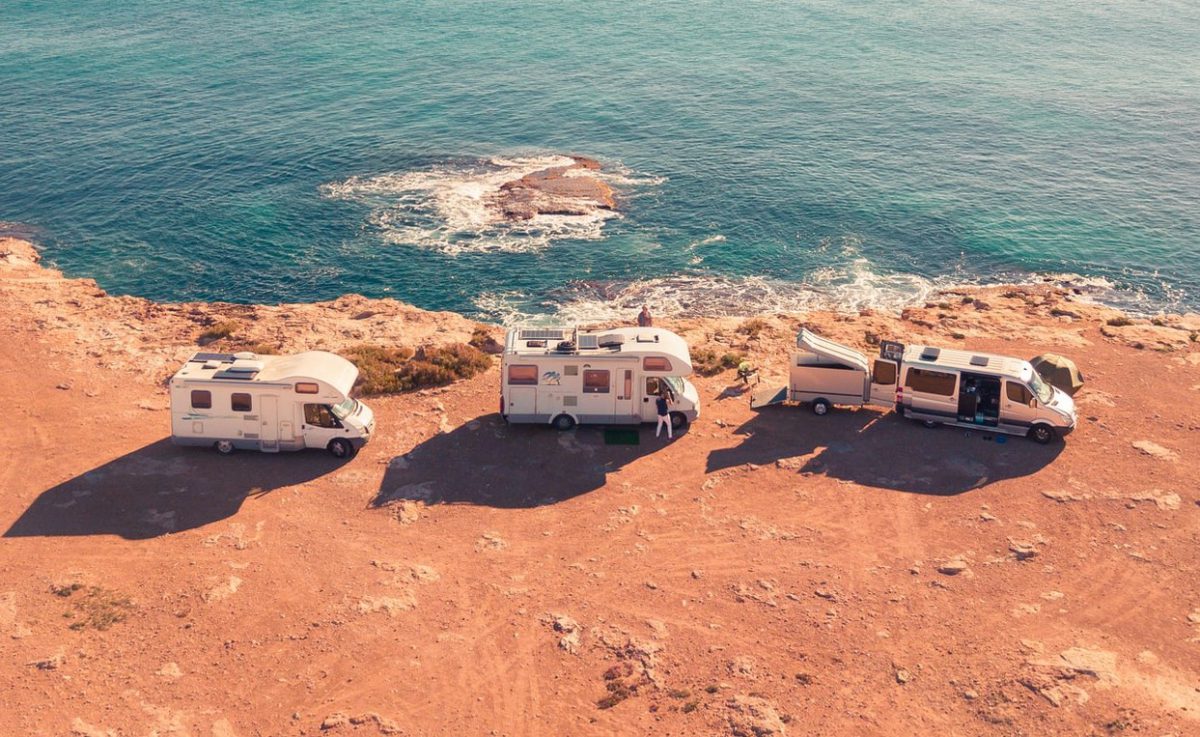 Several different RVs on a cliff